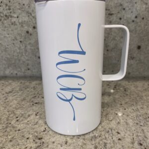 white coffee mug with a logo WCB